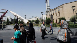 People walk next to a symbolic mock-up of an Iranian missile, on a street in Tehran, Iran, June 11, 2026. Photo: Majid Asgaripour/WANA (West Asia News Agency) via REUTERS