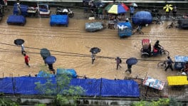 Heavy monsoon rain leaves roads in Dhaka’s Azimpur waterlogged on 12 July 2026, disrupting traffic and slowing commuters. Photo: Jarin Tasnim Tuba/TBS